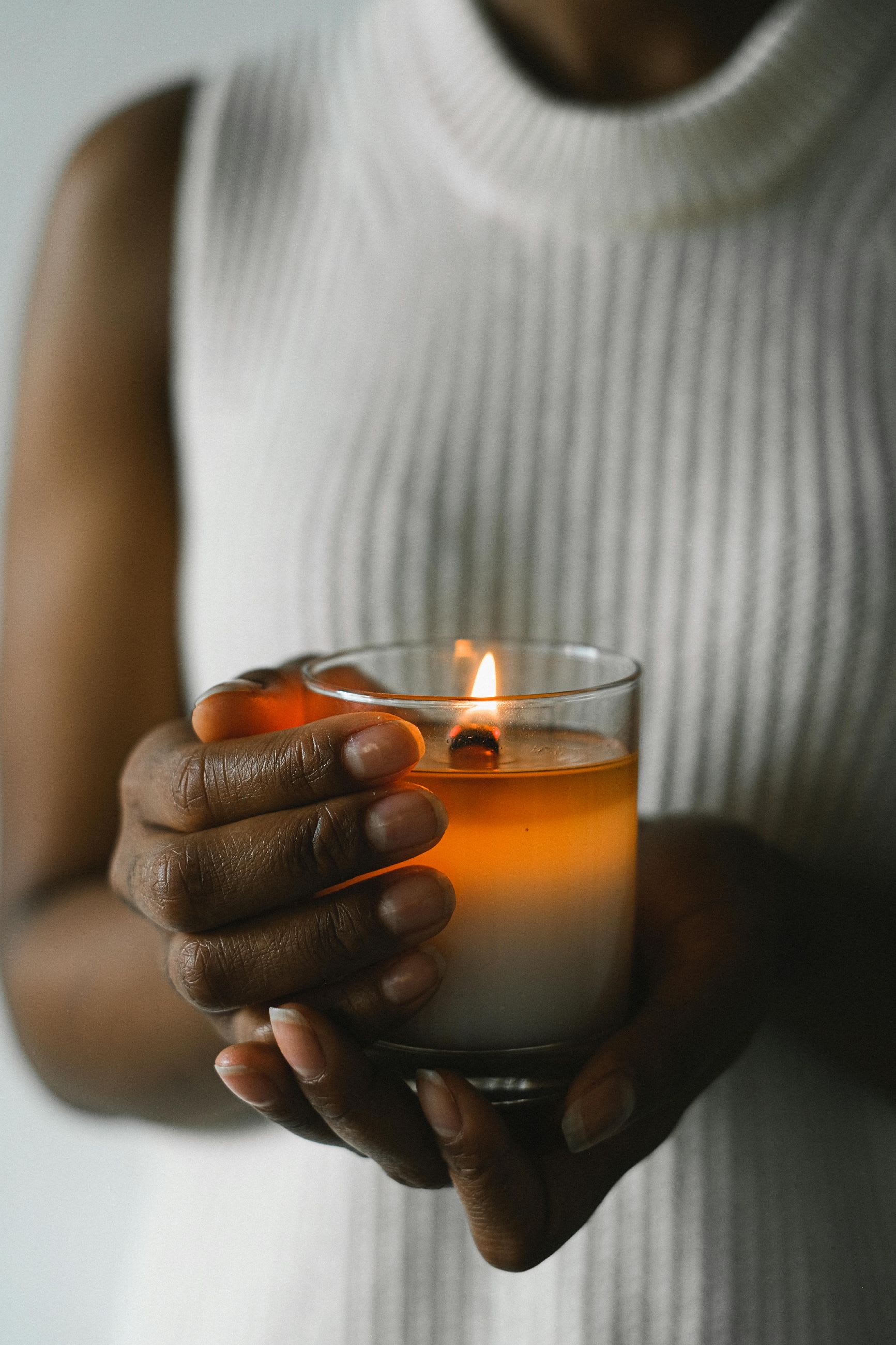 Hand-poured candle glowing softly
